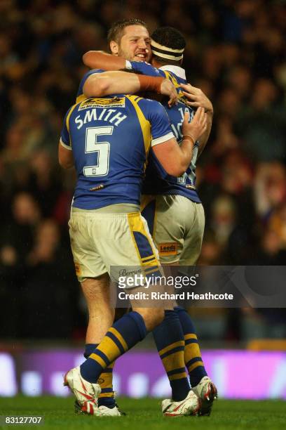 Lee Smith, Nick Scruton and Jamie Jones Buchanan of Leeds celebrate their team's victory as the final whistle blows during the engage Super League...