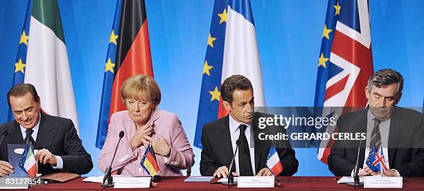 French President Nicolas Sarkozy , flanked by Italian Prime Minister Silvio Berlusconi, German chancellor Angela Merkel and British Prime Minister...