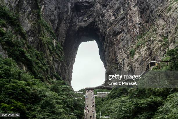 huge karst cave named 'heaven's gate' in mt.tianmenshan, zhangjiajie - zhangjiajie national forest park stock pictures, royalty-free photos & images