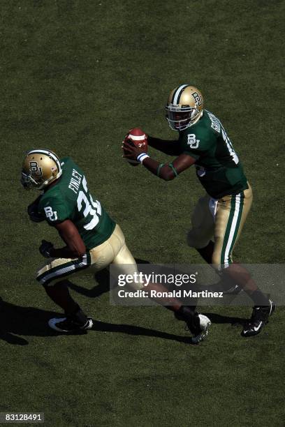 Quarterback Robert Griffin of the Baylor Bears drops back to pass against the Oklahoma Sooners at Floyd Casey Stadium on October 4, 2008 in Waco,...