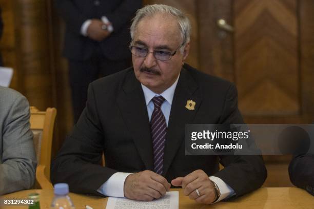 Libyan National Army Commander Khalifa Haftar speaks with Russian Foreign Minister Sergei Lavrov during their meeting in Moscow, Russia on August 14,...