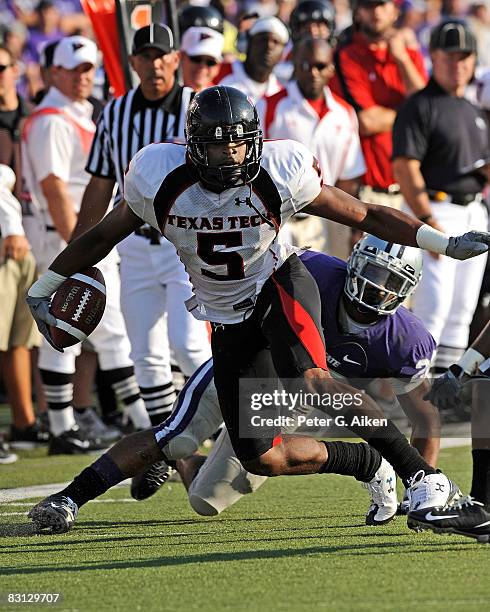 Wide receiver Michael Crabtree of the Texas Tech Red Raiders rushes up field in the first half for a first down, during a game against the Kansas...