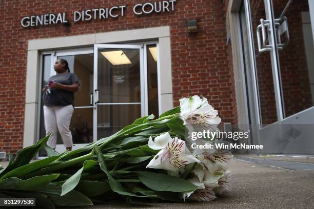 Flowers are left outside the Charlottesville General District Court before a scheduled appearance via video link for James Alex Fields Jr. August 14,...