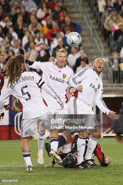Real Salt Lake's Kyle Beckerman, Nat Borchers and Will Johnson, battle for ball possession with Taylor Twellman of the New England Revolution during...