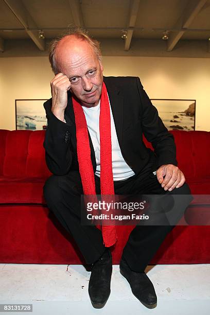 Fine art photographer Horst Wackerbarth poses on "The Red Couch", at the inaugural exhibition of photographic artwork by Wackerbarth at Wolfgang Roth...