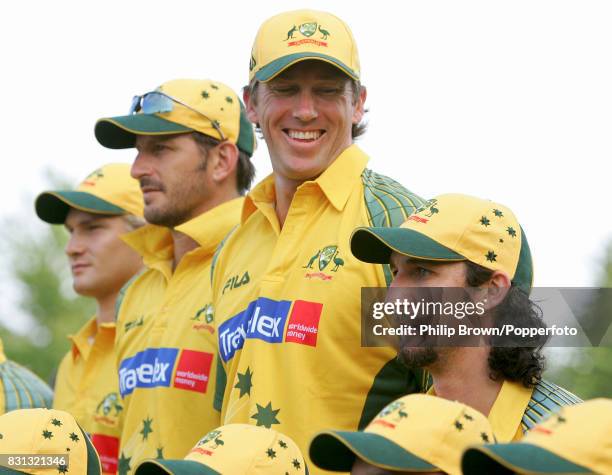 Australia's Glenn McGrath laughs as team-mate Jason Gillespie makes himself shorter during the official team photo before the tour match between PCA...