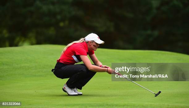 Megan Lockett of Wales lines up her putt on the 3rd green during The Ladies' and Girls' Home Internationals at Little Aston Golf Club on August 11,...