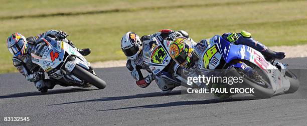 Newly-crowned MotoGP world champion Valentino Rossi of Italy leads Randy De Puniet of France and compatriot Andrea Davizioso through a corner during...