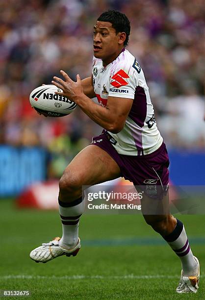 Israel Folau of the Storm runs with the ball during the NRL Grand Final match between the Manly Warringah Sea Eagles and the Melbourne Storm at ANZ...