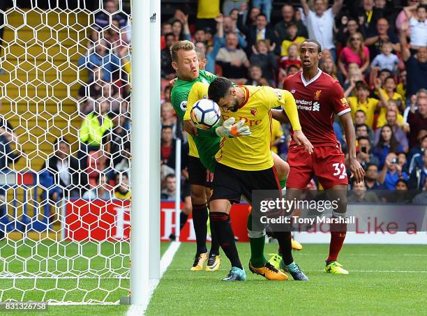 Miguel Britos of Watford heads the ball to score their third goal during the Premier League match between Watford and Liverpool at Vicarage Road on...