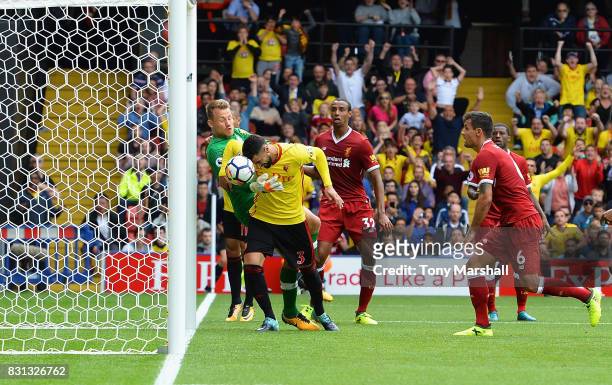 Miguel Britos of Watford heads the ball to score their third goal during the Premier League match between Watford and Liverpool at Vicarage Road on...