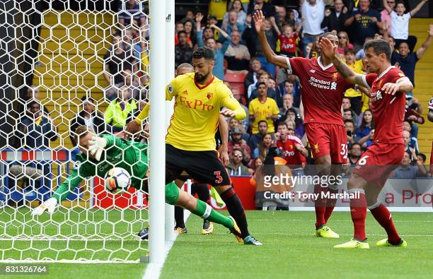 Miguel Britos of Watford scores their third goal during the Premier League match between Watford and Liverpool at Vicarage Road on August 12, 2017 in...