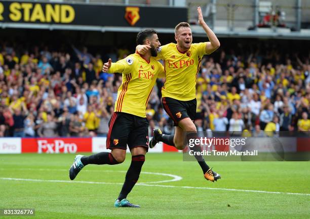 Miguel Britos of Watford celebrates scoring their third goal with Tom Cleverley of Watford during the Premier League match between Watford and...