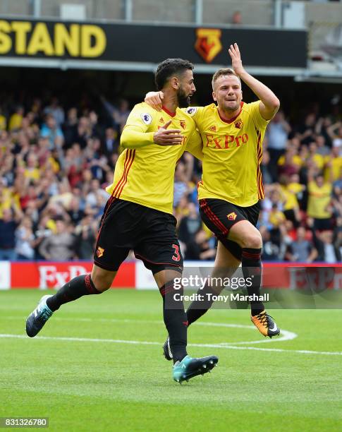 Miguel Britos of Watford celebrates scoring their third goal with Tom Cleverley of Watford during the Premier League match between Watford and...