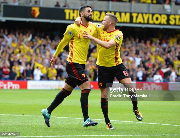 Miguel Britos of Watford celebrates scoring their third goal with Tom Cleverley of Watford during the Premier League match between Watford and...