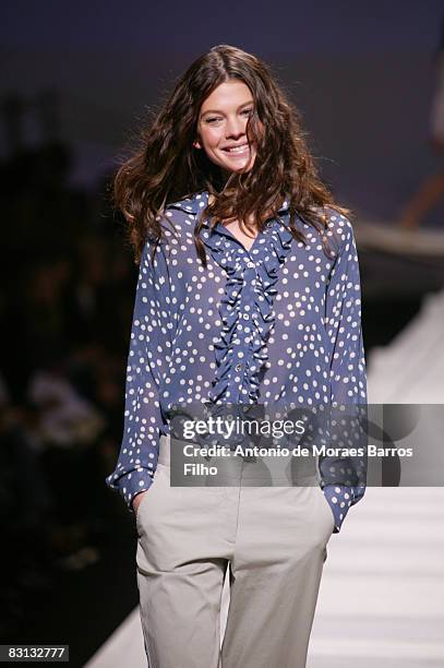 Model walks the runway at the Paul & Joe fashion show during Paris Fashion Week at Le Carrousel du Louvre on October 4, 2008 in Paris, France.