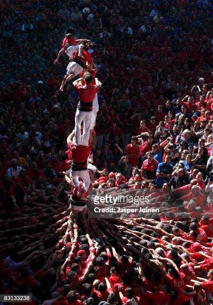 Castellers of the Colla Jove Xiquets de Tarragona 'colle' fall down while building a human tower during the 22nd Tarragona Castells Competition on...