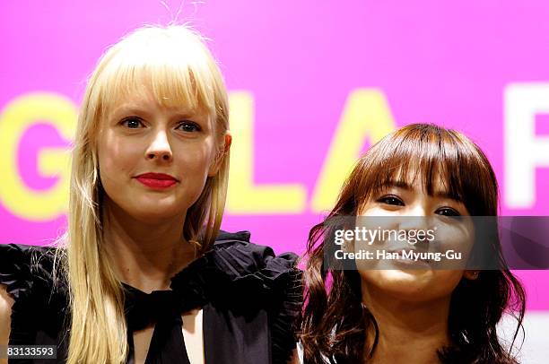 Movie "Make Yourself at Home" actress Song Hye-Kyo and Athena Currey pose during a press conference at the 13th Pusan International Film Festival on...