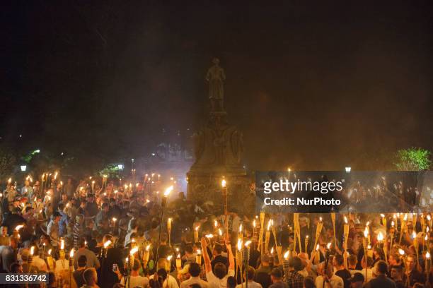 Neo Nazis, Alt-Right, and White Supremacists encircle counter protestors at the base of a statue of Thomas Jefferson after marching through the...