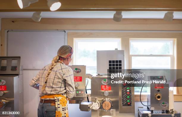 Kelli Grover works with Italgi machines while making fresh pasta at Raven's Nest Farm in Goulsdboro.