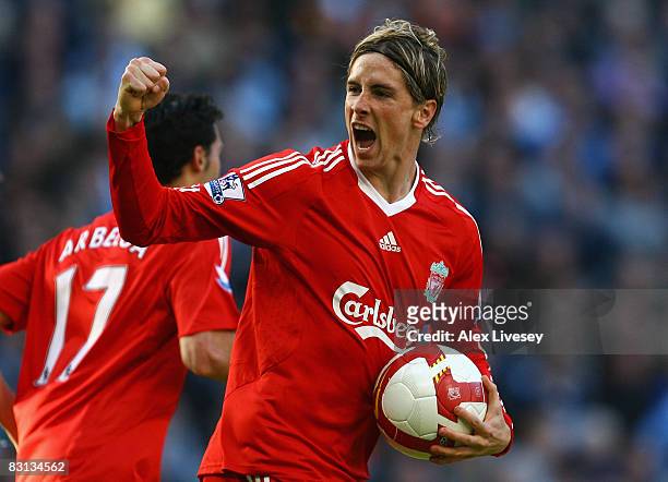 Fernando Torres of Liverpool celebrates scoring his team's first goal during the Barclays Premier League match between Manchester City and Liverpool...