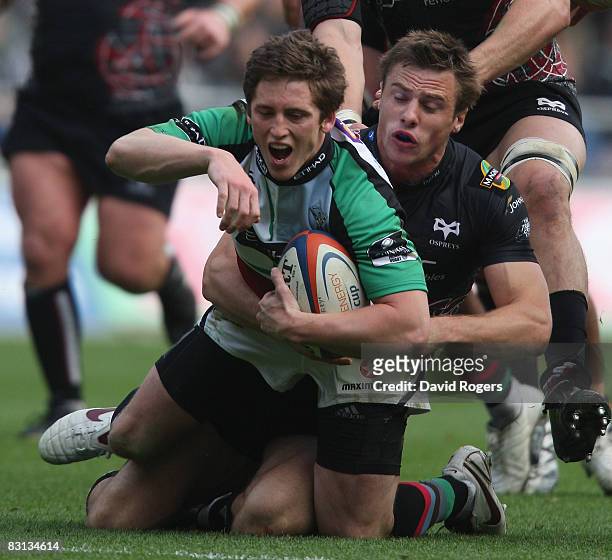 Tom Williams of Harlequins is tackled by Tommy Bowe during the EDF Energy Cup match between Ospreys and Harlequins at the Liberty Stadium on October...