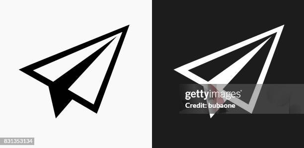 paper airplane icon on black and white vector backgrounds - glider stock illustrations