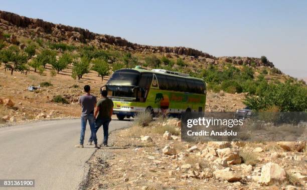 Syrian refugees and members of Ahrar al-Sham connected with Free Syrian Army are seen on the way back their home country with buses and vehicles...