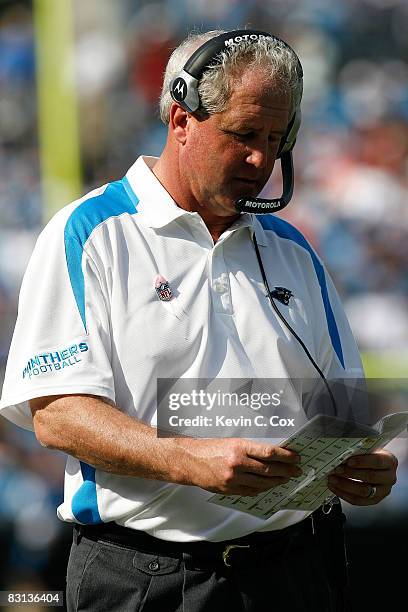 Head coach John Fox of the Carolina Panthers looks at the playbook during the game against the Kansas City Chiefs at Bank of America on October 5,...