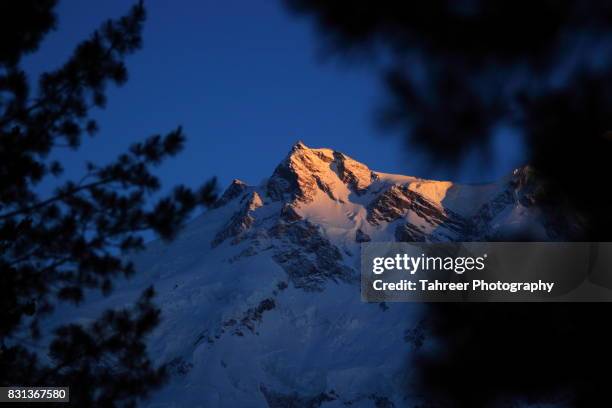 the last light on nanga parbat mountain - nanga parbat stock pictures, royalty-free photos & images