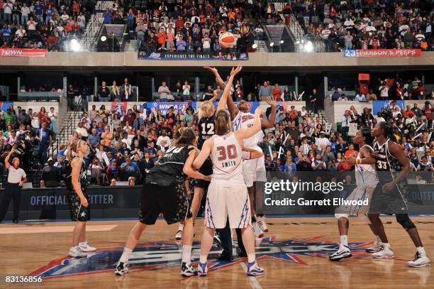 Ann Wauters of the San Antonio Silver Stars jumps ball against Kara Braxton of the Detroit Shock during Game Three of the WNBA Finals on October 5,...