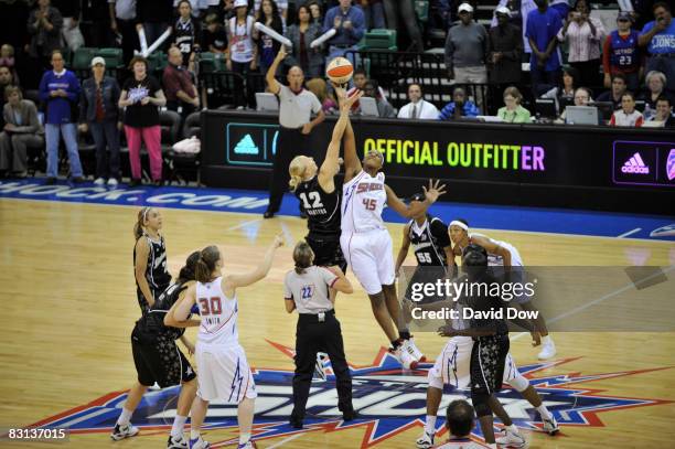 Ann Wauters of the San Antonio Silver Stars jumps ball against Kara Braxton of the Detroit Shock during Game Three of the WNBA Finals on October 5,...