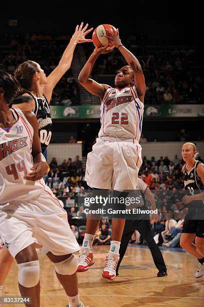 Alexis Hornbuckle of the Detroit Shock shoots against Ruth Riley of the San Antonio Silver Stars during Game Three of the WNBA Finals on October 5,...