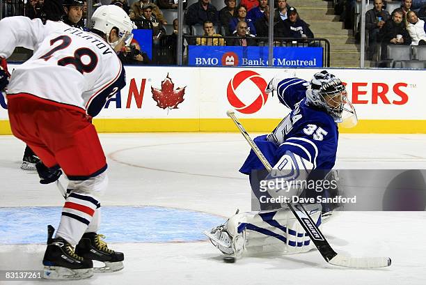 Nikita Filatov of the Columbus Blue Jackets looks for a rebound as Vesa Toskala of the Toronto Maple Leafs makes a toe save during their pre season...