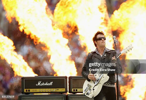 Chris Cheney of the band The Living End performs on stage before the NRL Grand Final match between the Manly Warringah Sea Eagles and the Melbourne...