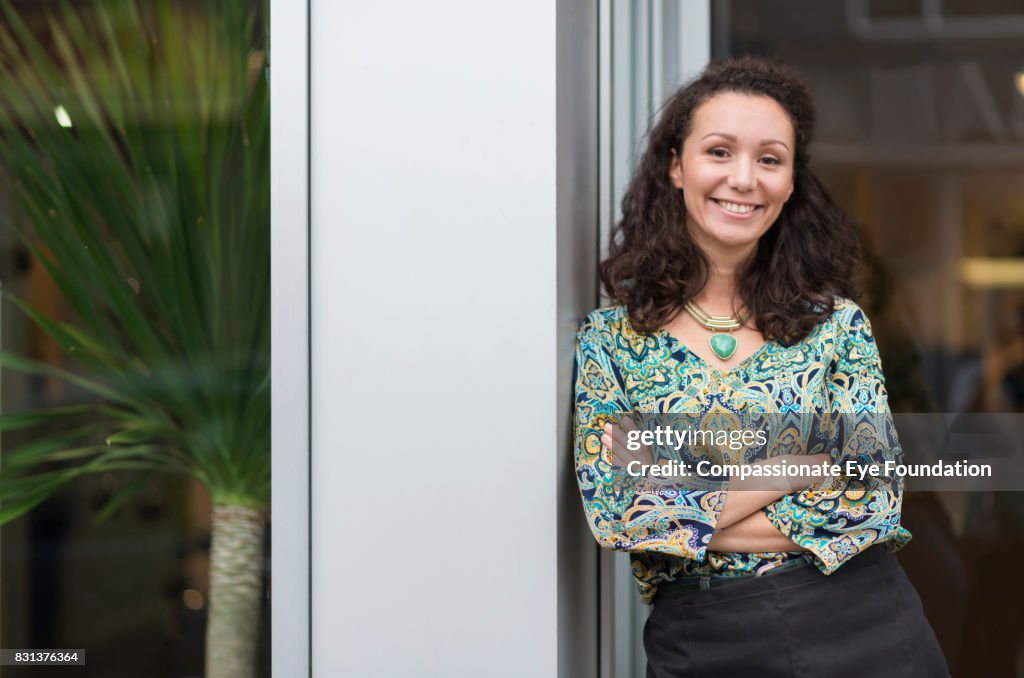 Portrait of shop owner outside flower shop