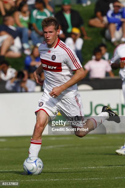 Brian McBride of the Chicago Fire dribbles the ball against the Kansas City Wizards during the game at Community America Ballpark on October 5, 2008...