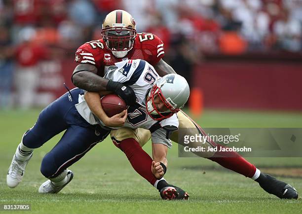 Matt Cassel of the New England Patriots is tackled by Patrick Willis of the San Francisco 49ers during an NFL game on October 5, 2008 at Candlestick...