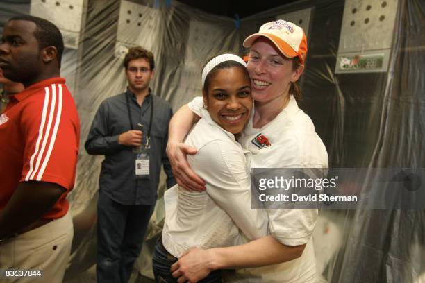 Lindsey Harding of the Minnesota Lynx celebrates with Katie Smith of the Detroit Shock in the lockerroom after winning Game Three of the WNBA Finals...