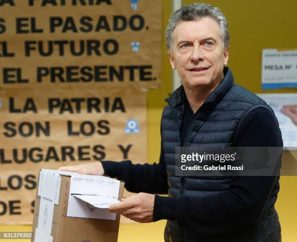 President of Argentina Mauricio Macri casts his vote during the midterm primary elections at Wencesleao Posse Nª16 school on August 13, 2017 in...