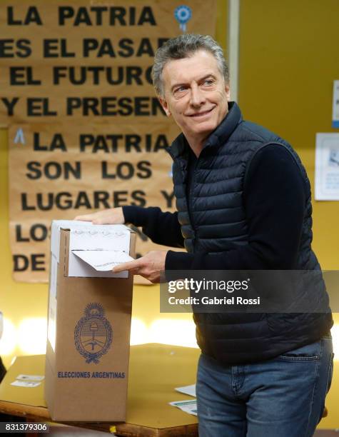 President of Argentina Mauricio Macri casts his vote during the midterm primary elections at Wencesleao Posse Nª16 school on August 13, 2017 in...