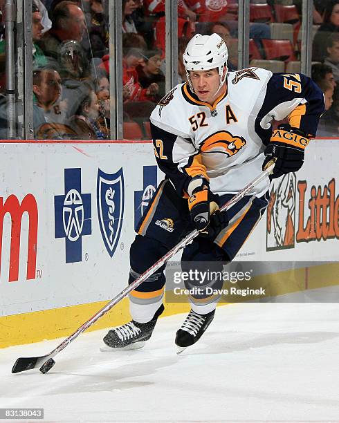 David Rivet of the Buffalo Sabres skates out from behind the net with the puck during a NHL preseason game against the Detroit Red Wings on October...