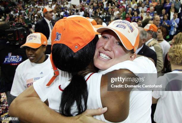 Kelly Schumacher of the Detroit Shock hugs a teammate after beating the San Antonio Silver Stars in Game 3 of the WNBA Finals at the Eastern Michigan...