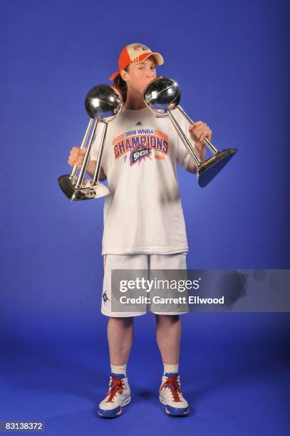 Katie Smith of the Detroit Shock poses for a portrait with the Championship Trophies after winning Game Three of the WNBA Finals against the San...