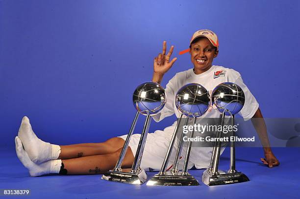 Deanna Nolan of the Detroit Shock poses for a portrait with the trophy after winning Game Three of the WNBA Finals against the San Antonio Silver...