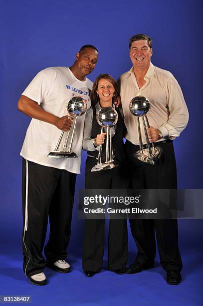 Coaches Rick Mahorn, Cheryl Reeves and Bill Laimbeer of the Detroit Shock poses for a portrait with the Championship Trophies after winning Game...