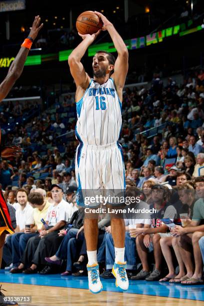 Peja Stojakovic of the New Orleans Hornets shoots against the Golden State Warriors on October 5, 2008 at the New Orleans Arena in New Orleans,...