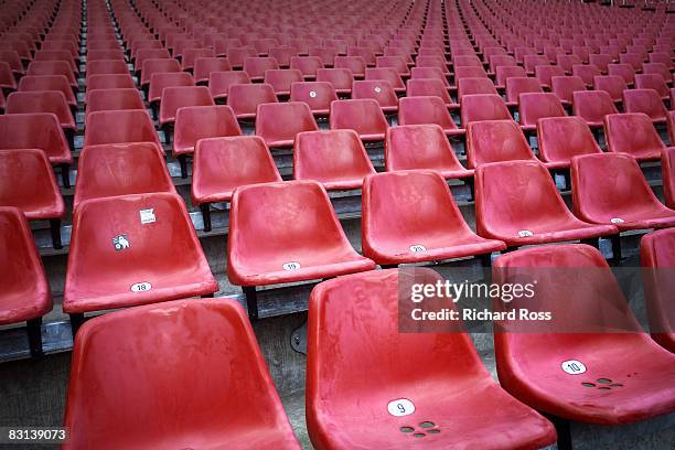 red chairs at a stadium - stadium seats stock pictures, royalty-free photos & images