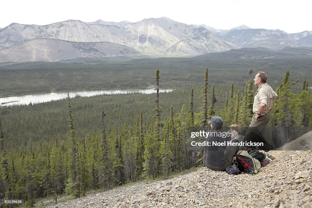 Hikers looking at view below