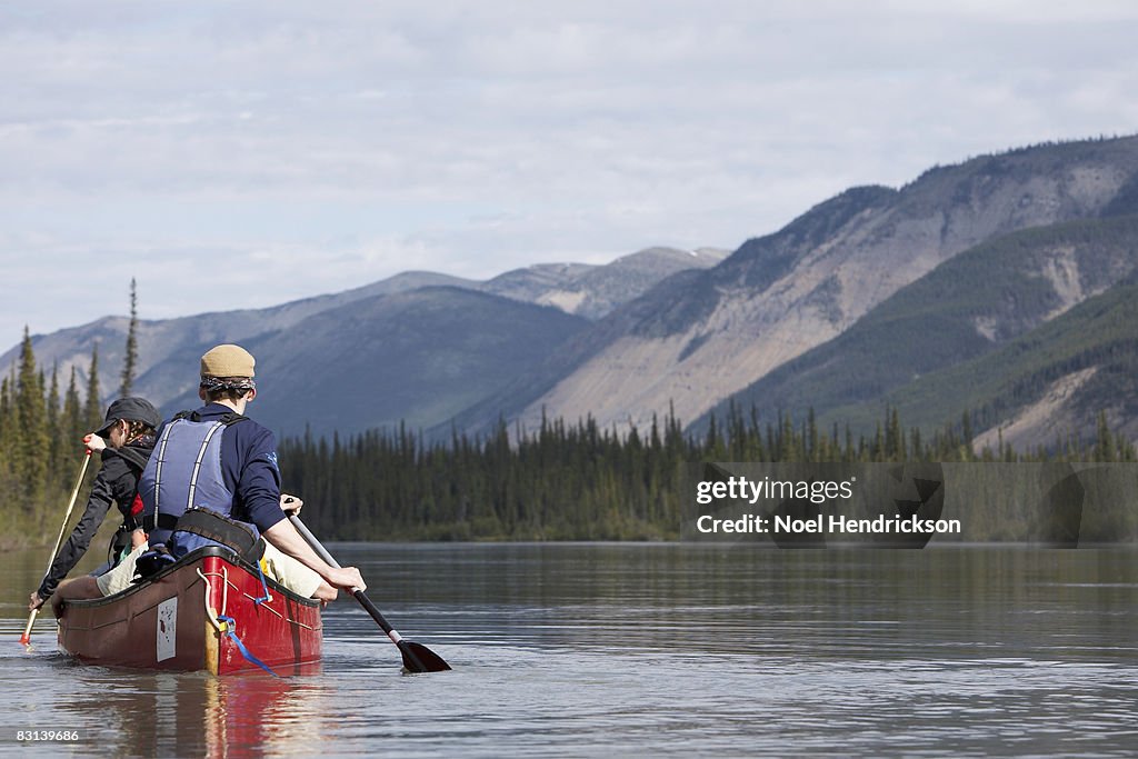 Two people in canoe on calm water